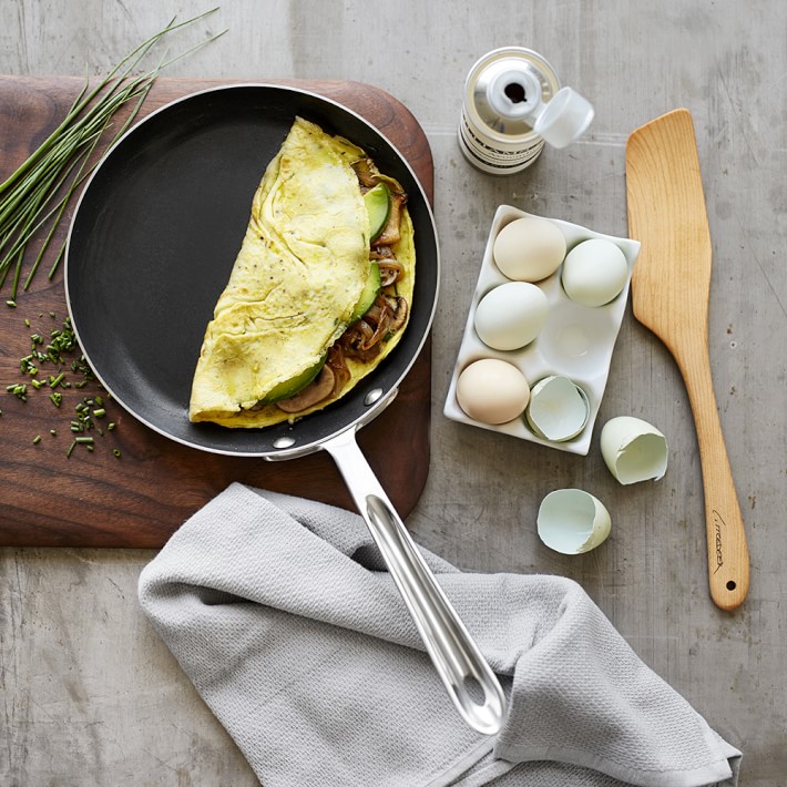 All-Clad HA1 pan with a perfectly flipped omelet
