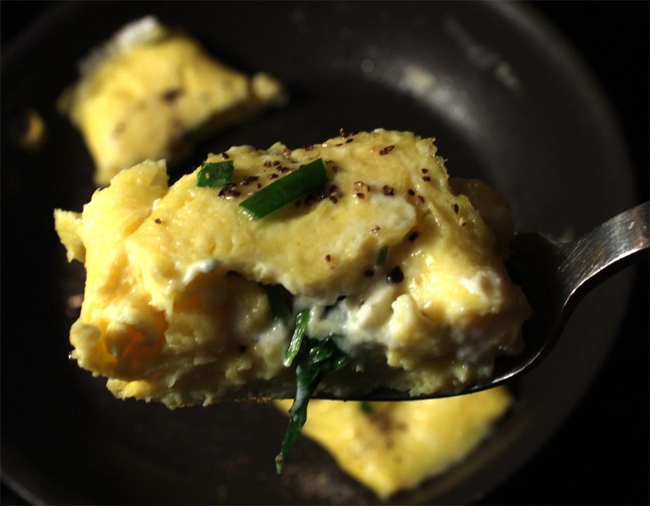 Step-by-step preparation of spinach and feta omelet
